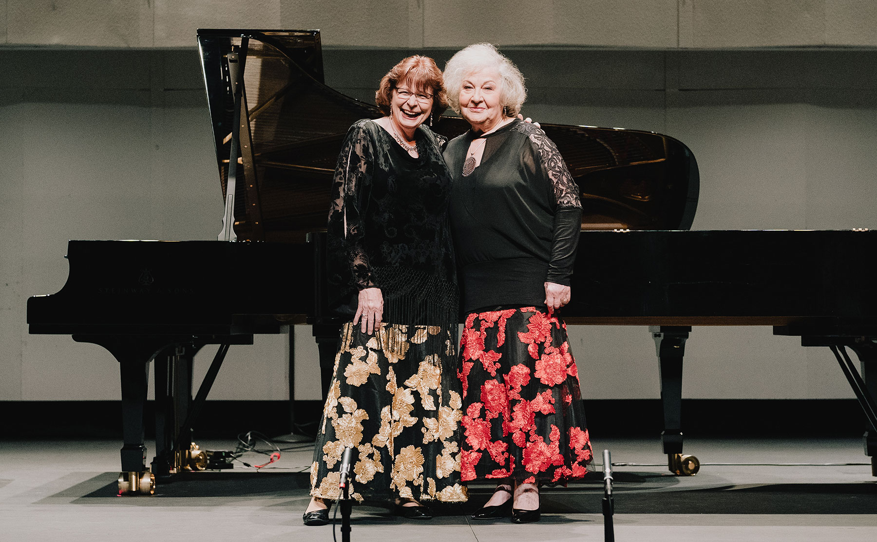 Dr. Linda Apple Monson and Dr. Anna Balakerskaia taking a bow after the 2022 A Grand Piano Celebration.