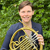 Dr. Caroline Steiger holding French Horn