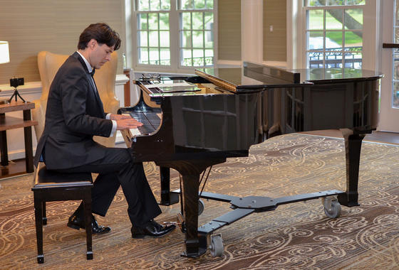 A solo Mason pianist entertained guests at a cocktail reception at the Country Club of Fairfax, VA.